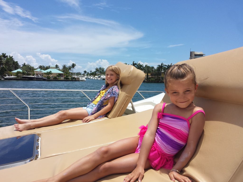 Two girls sitting on the yacht