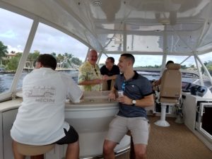 A group of people enjoying inside the yacht