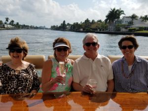 Four senior people enjoying on a yacht