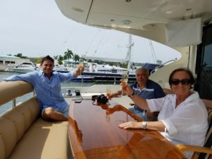people raising their glasses on a yacht