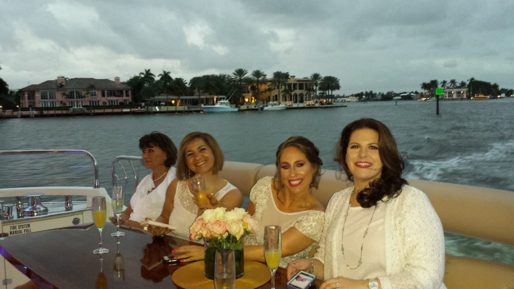 Four beautiful women drinking on the yacht