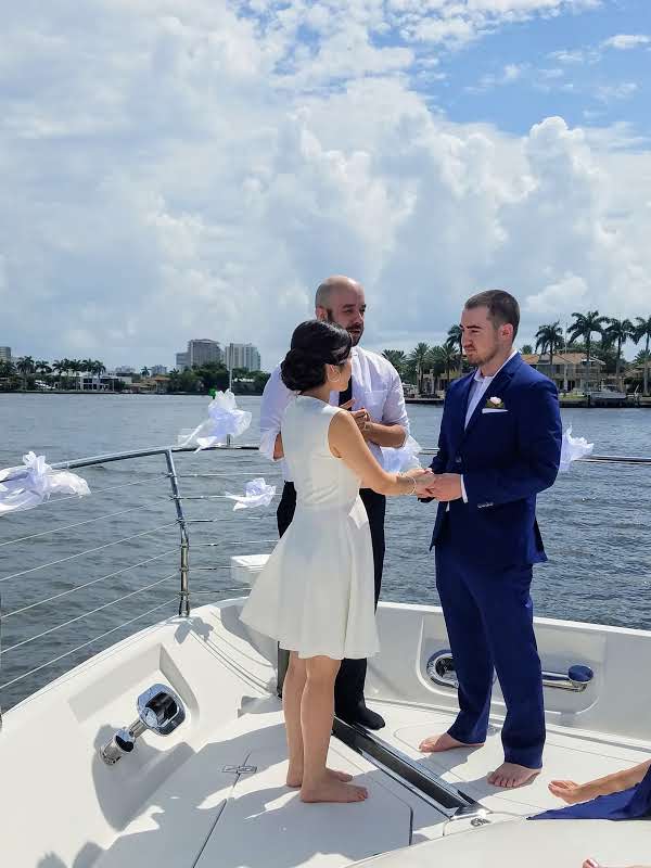 A beautiful wedding ceremony taking place on a yacht