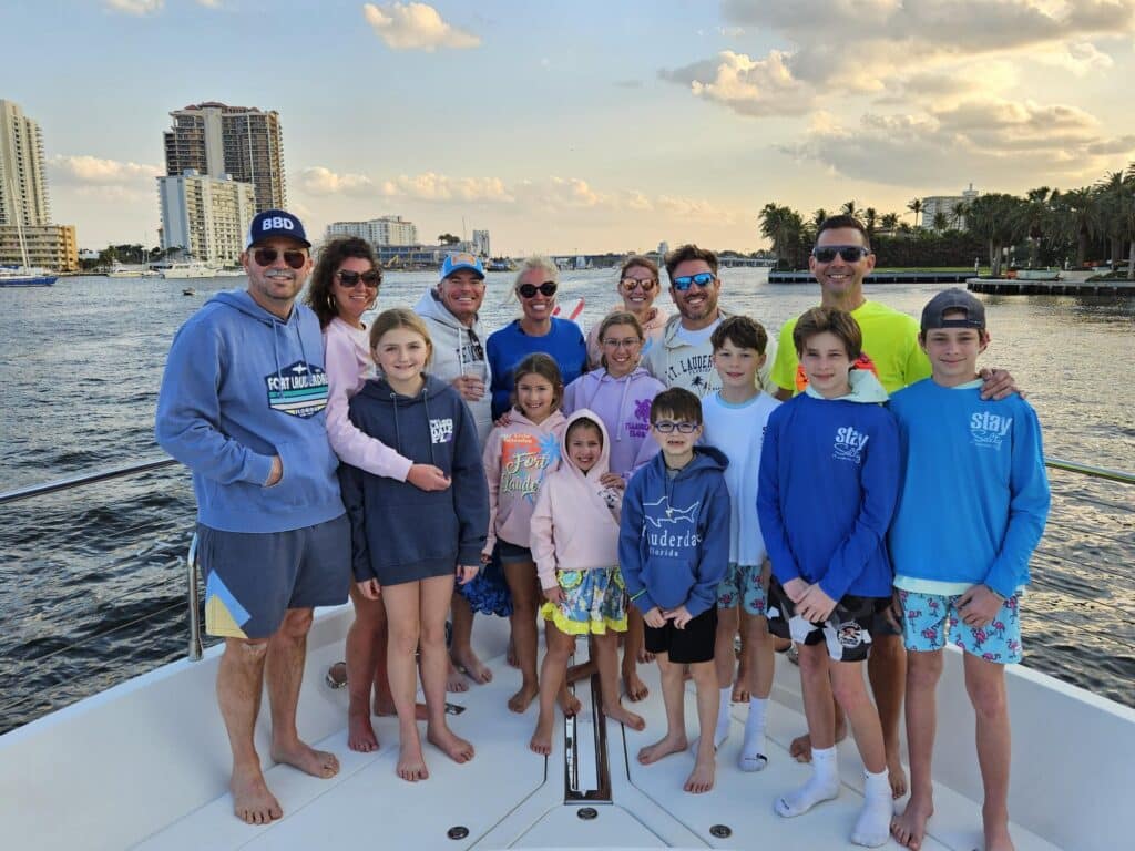 Large family group enjoys a sunset cruise along the south Florida waterways