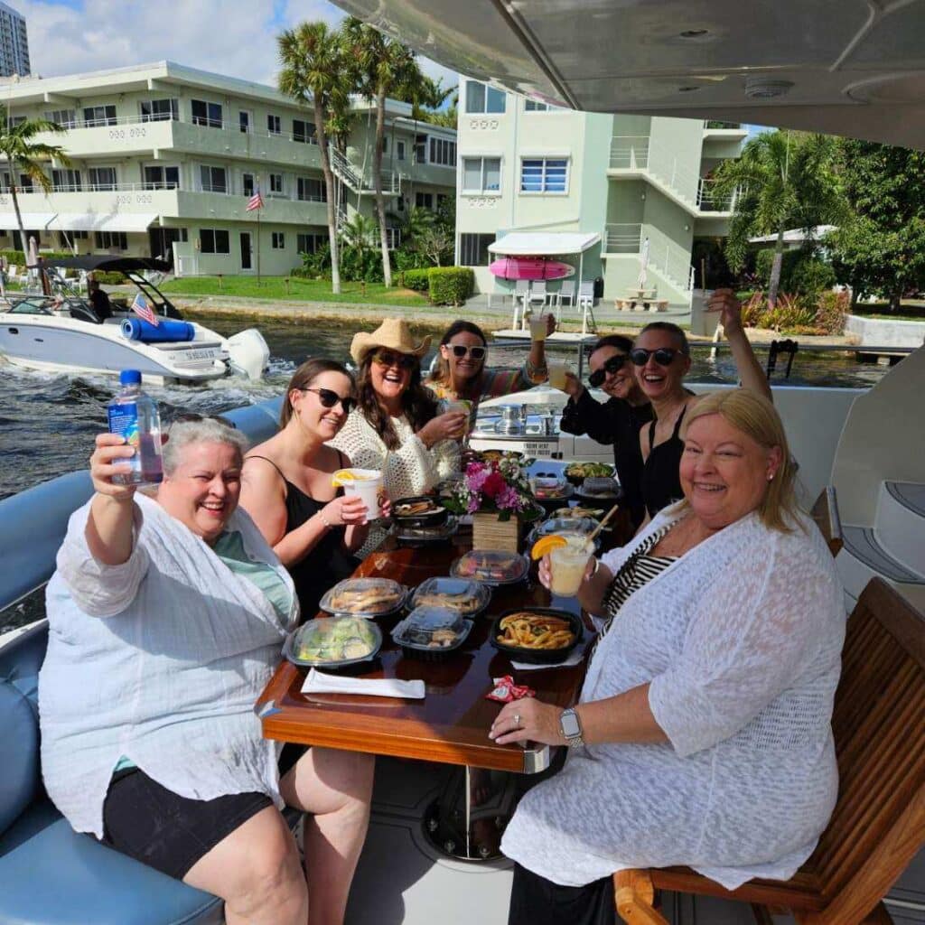 Seven women enjoy our deliciously prepared food while enjoying a ride on the aft deck of our luxury yacht.